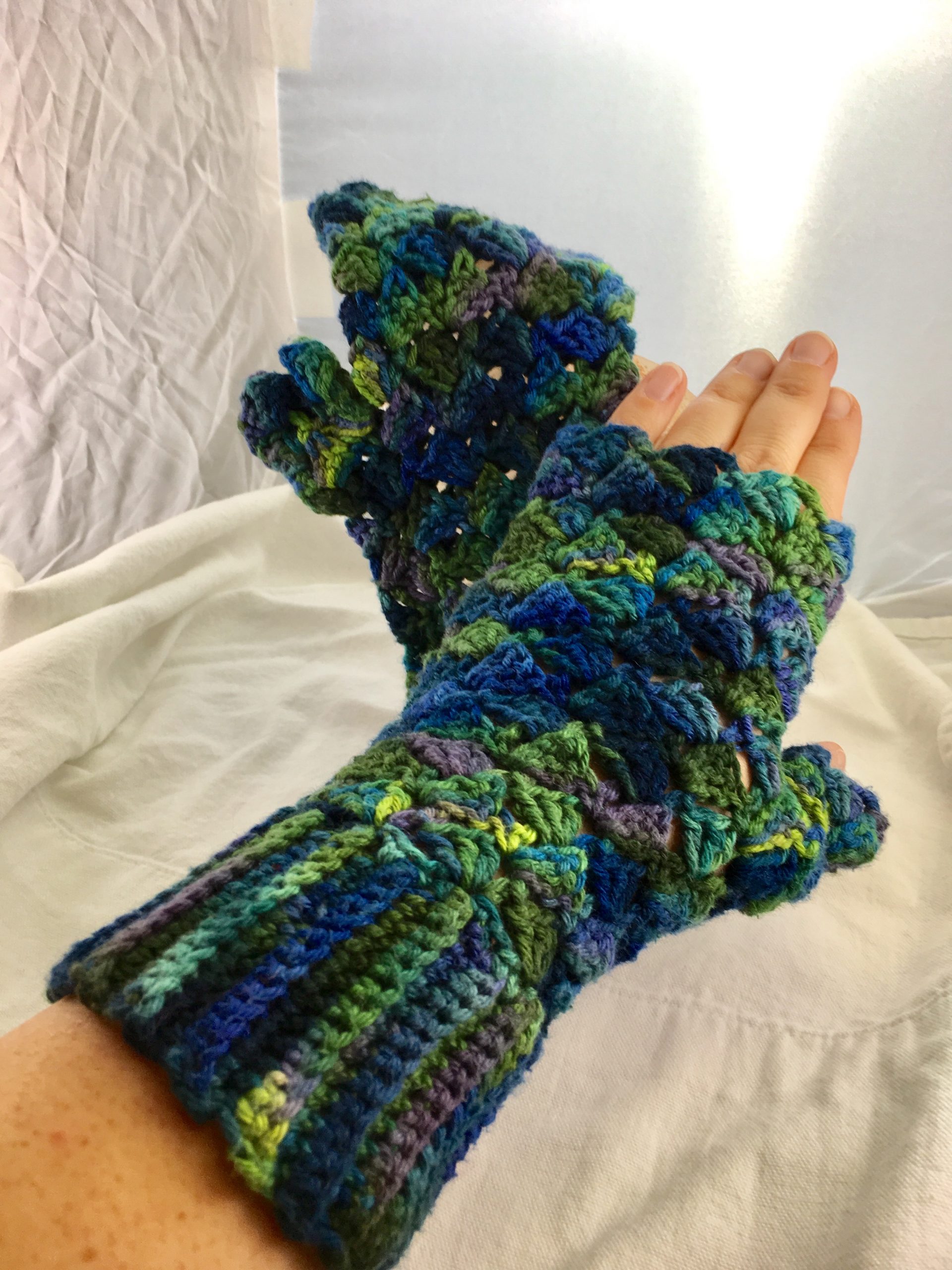 blue and green fingerless gloves